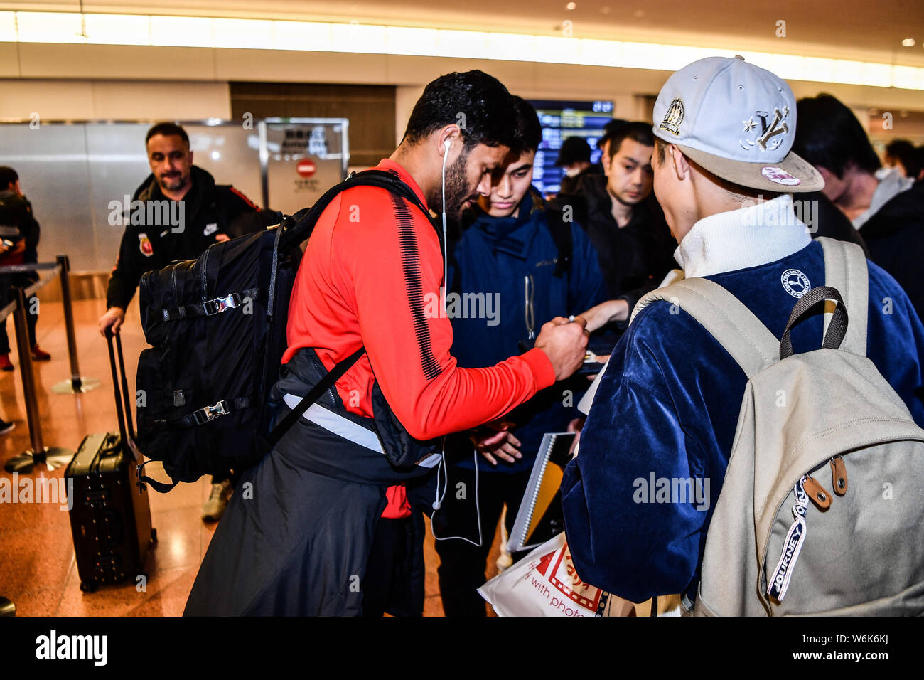 Brazilian soccer player Givanildo Vieira de Sousa, better known as Hulk, of Shanghai SIPG F.C. signs autographs for Japanese fans upon arrival at the Stock Photo