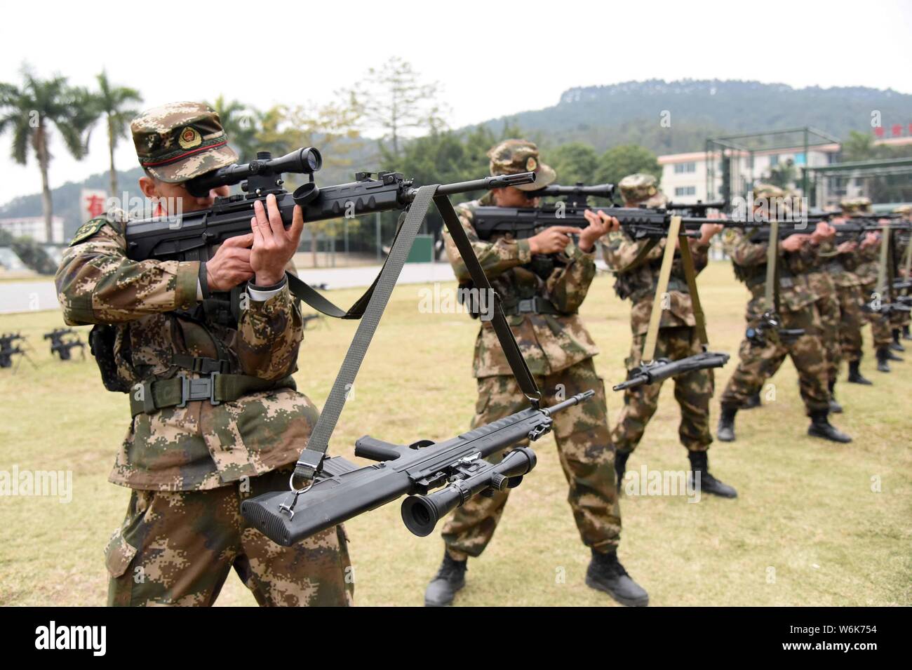 Guangxi Armed Police snipers aim at the targets with shell cases piling up  on the guns during a shooting training in Nanning city, south China's Guang  Stock Photo - Alamy, image size:1300x955