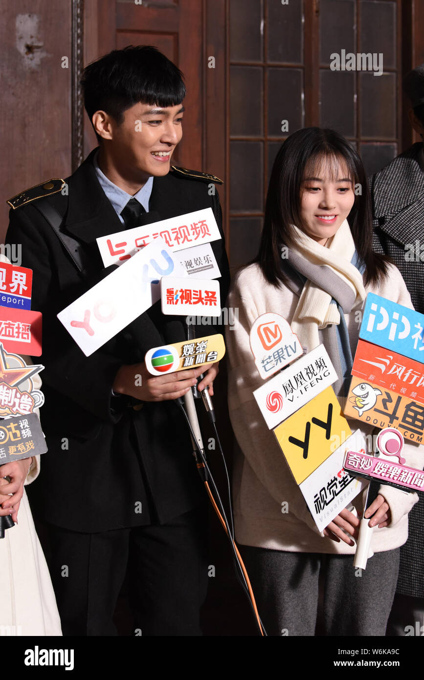 Chinese Singer And Actress Ju Jingyi Right Taiwanese Singer And Actor ron Yan Are Interviewed On Set Of The Tv Drama Please Give Me A Pair Of Win Stock Photo Alamy