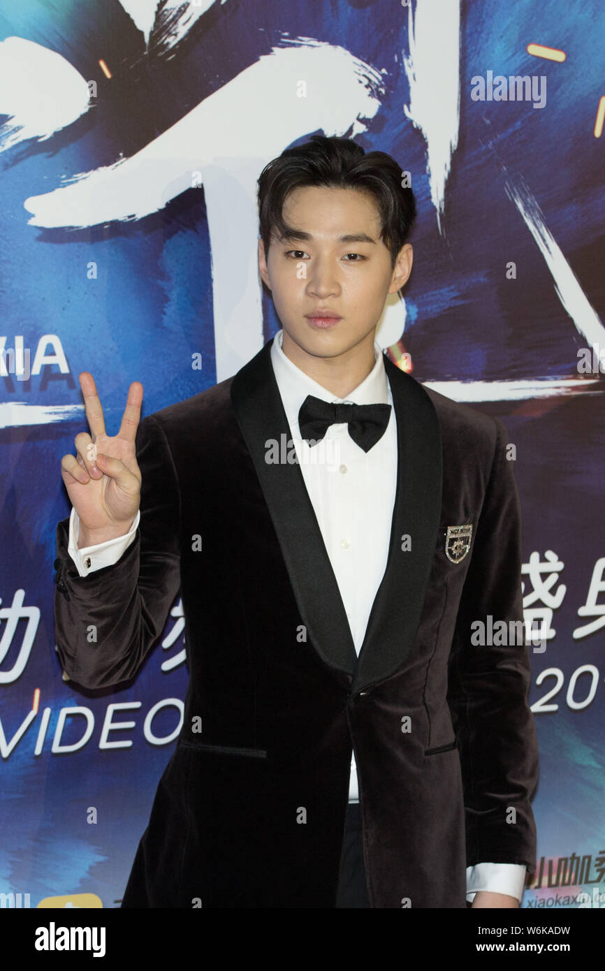 Canadian singer and actor Henry Lau poses as he arrives on the red