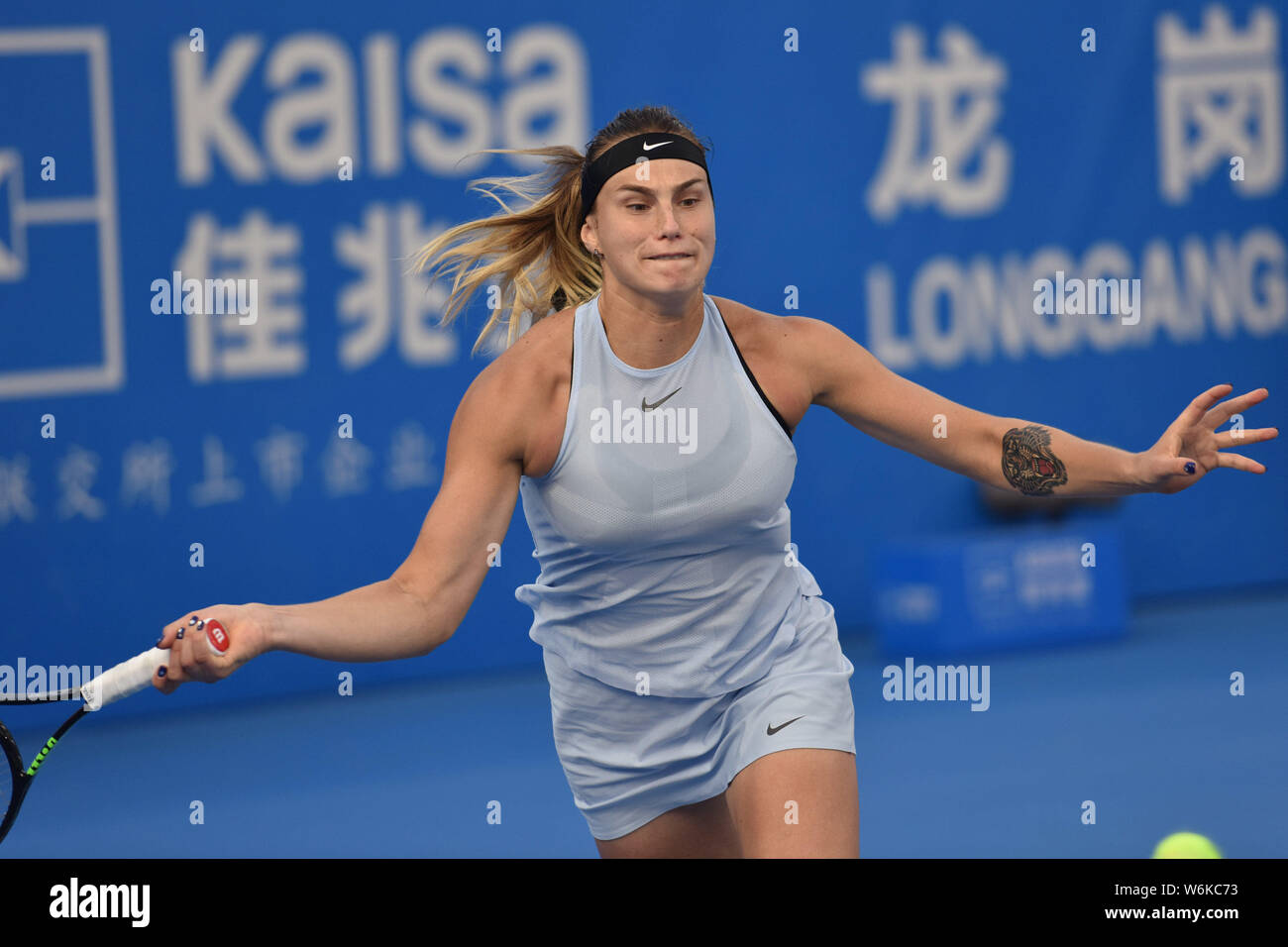 Aryna Sabalenka of Belarus returns a shot to Simona Halep of Romania in