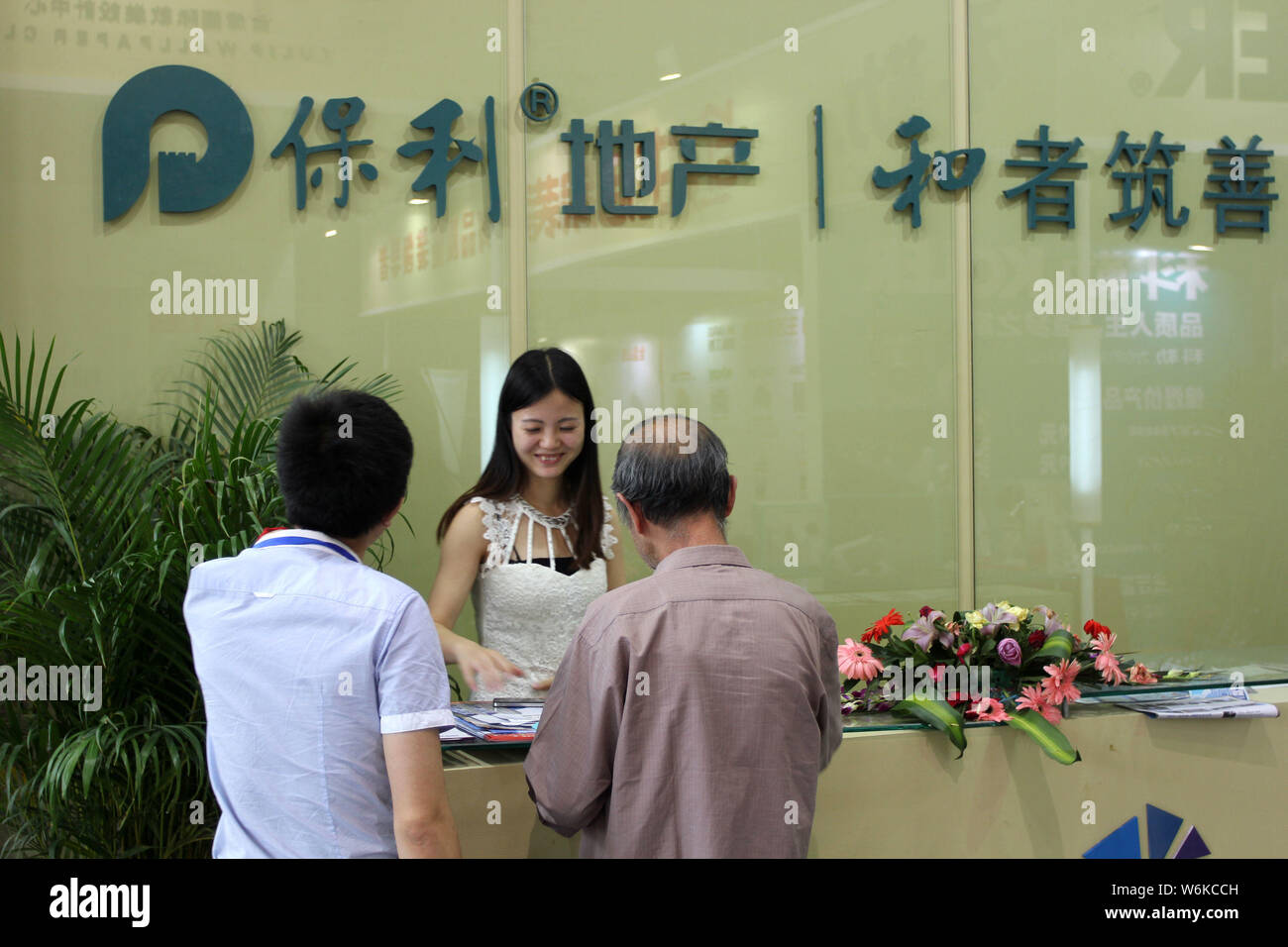 FILEPeople visit the stand of Poly Real Estate Group during a real