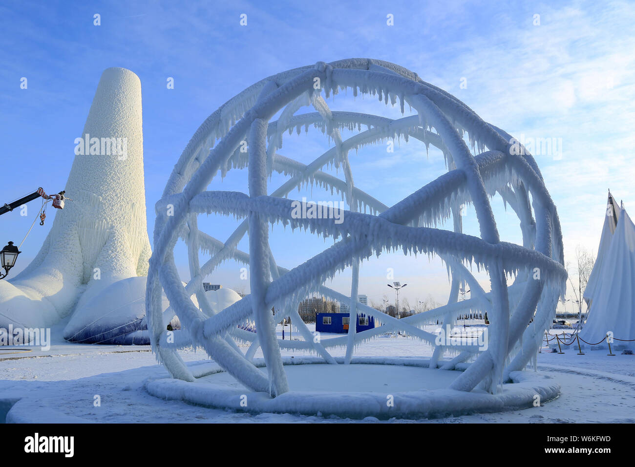 A Chinese worker labors at the world's tallest ice tower, which is 30