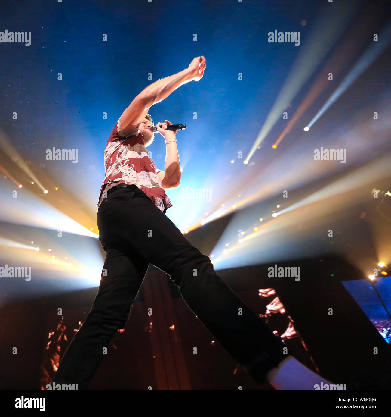 American singer-songwriter Daniel Coulter Reynolds (Dan Reynolds), the lead vocalist of American rock band Imagine Dragons, performs during the band's Stock Photo
