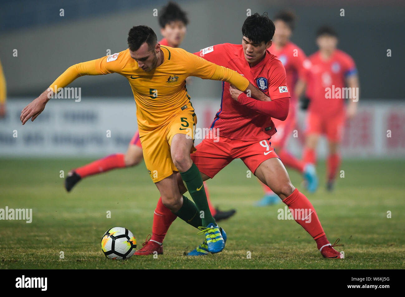 Lee Keun-ho, right, of South Korea challenges Aleksandar Susnjar of Australia in their Group D match during the 2018 AFC U-23 Championship in Kunshan Stock Photo