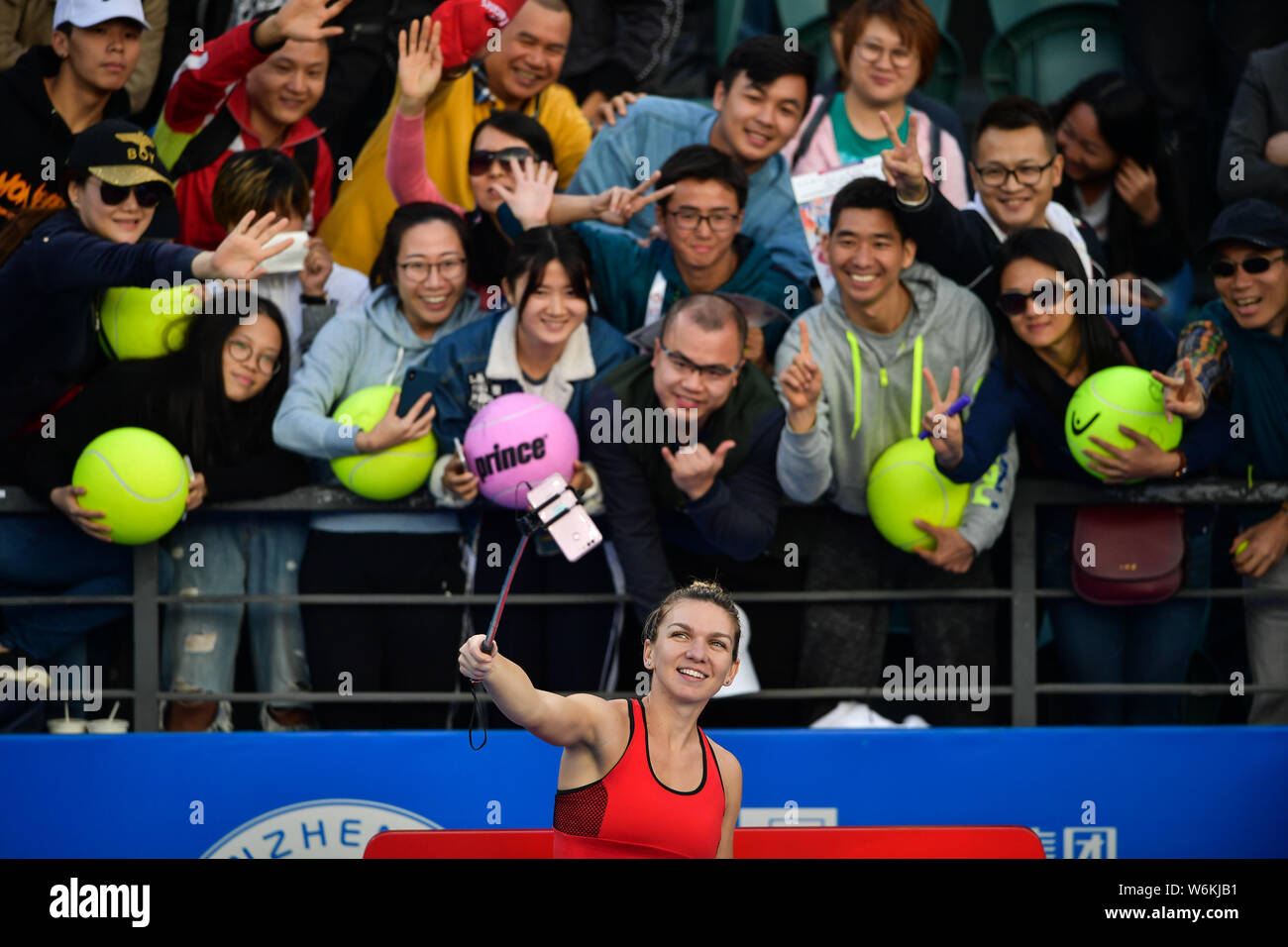 Simona Halep of Romania reacts after defeating Aryna Sabalenka of