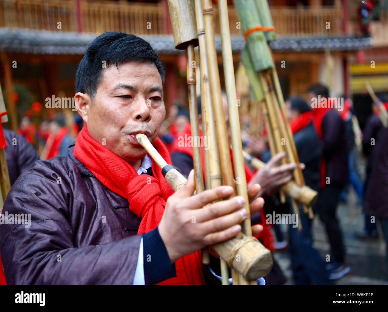 Chinese men of Dong ethnic group play the traditonal wind instrument called  "Sheng" to celebrate their Dongnian festival, a traditional festival for h  Stock Photo - Alamy