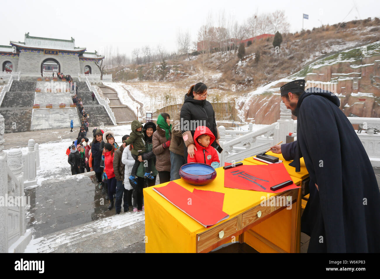 Chinese villagers queue up to get Chinese character