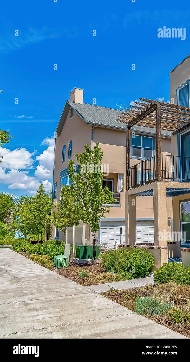 Vertical Concrete pathway in front of houses with balconies and porches ...