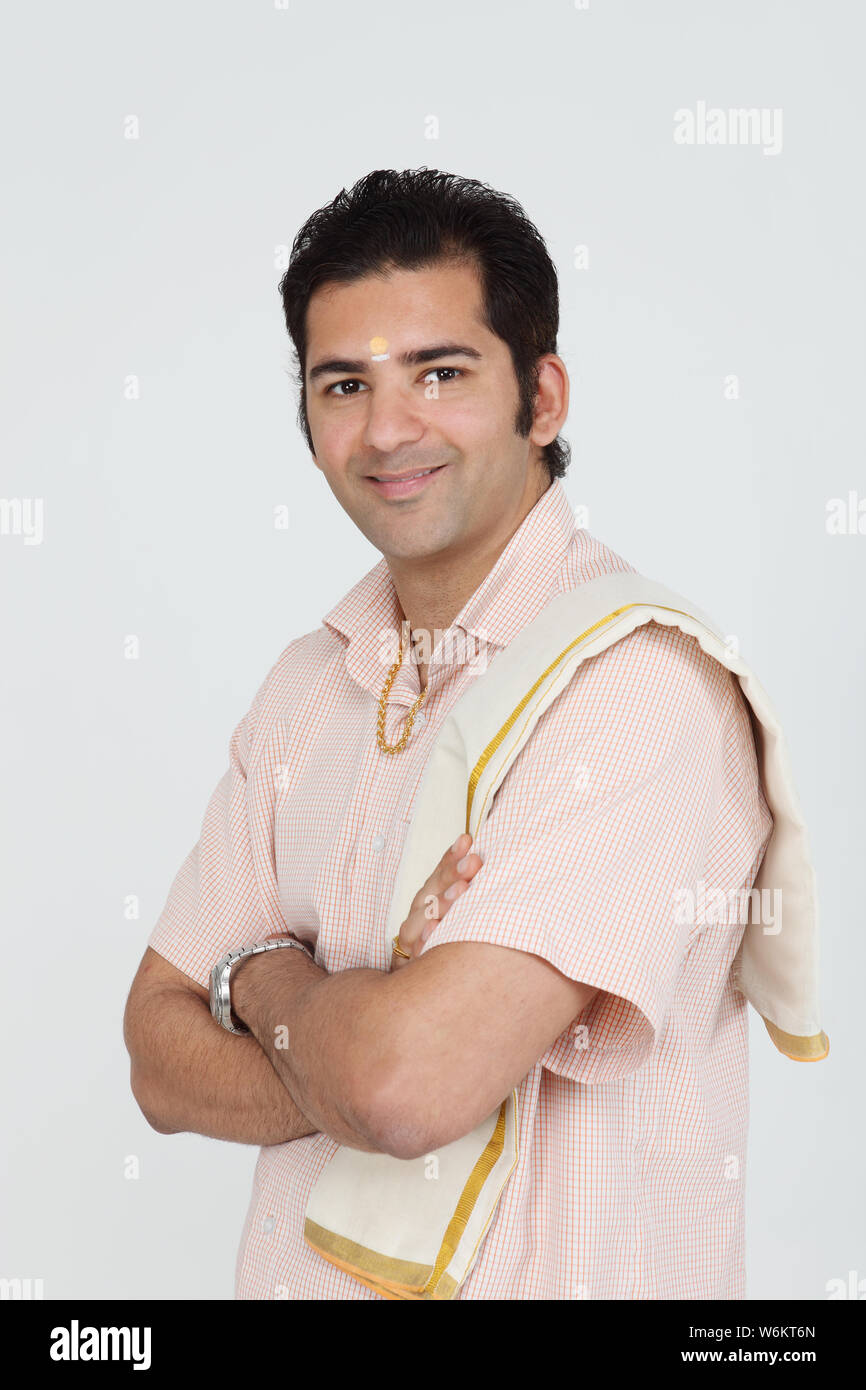 South Indian man standing with his arms crossed Stock Photo Alamy
