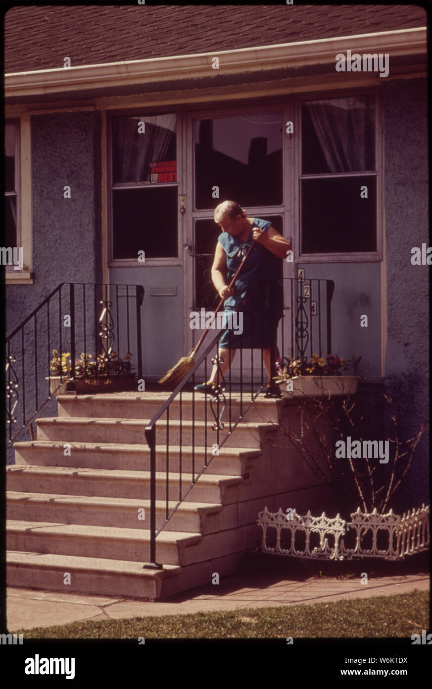 SWEEPING THE FRONT STEPS Stock Photo Alamy