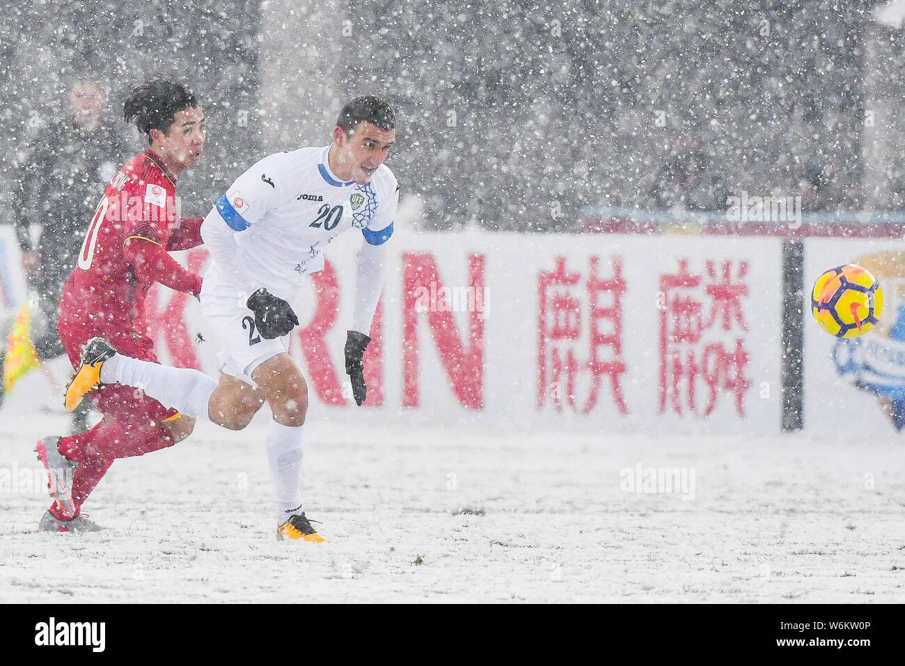 Dostonbek Tursunov Right Of Uzbekistan Kicks The Ball To Make A Pass Against Nguyen Cong Phuong Of Vietnam In Their Final Match To Fight For The Cha Stock Photo Alamy