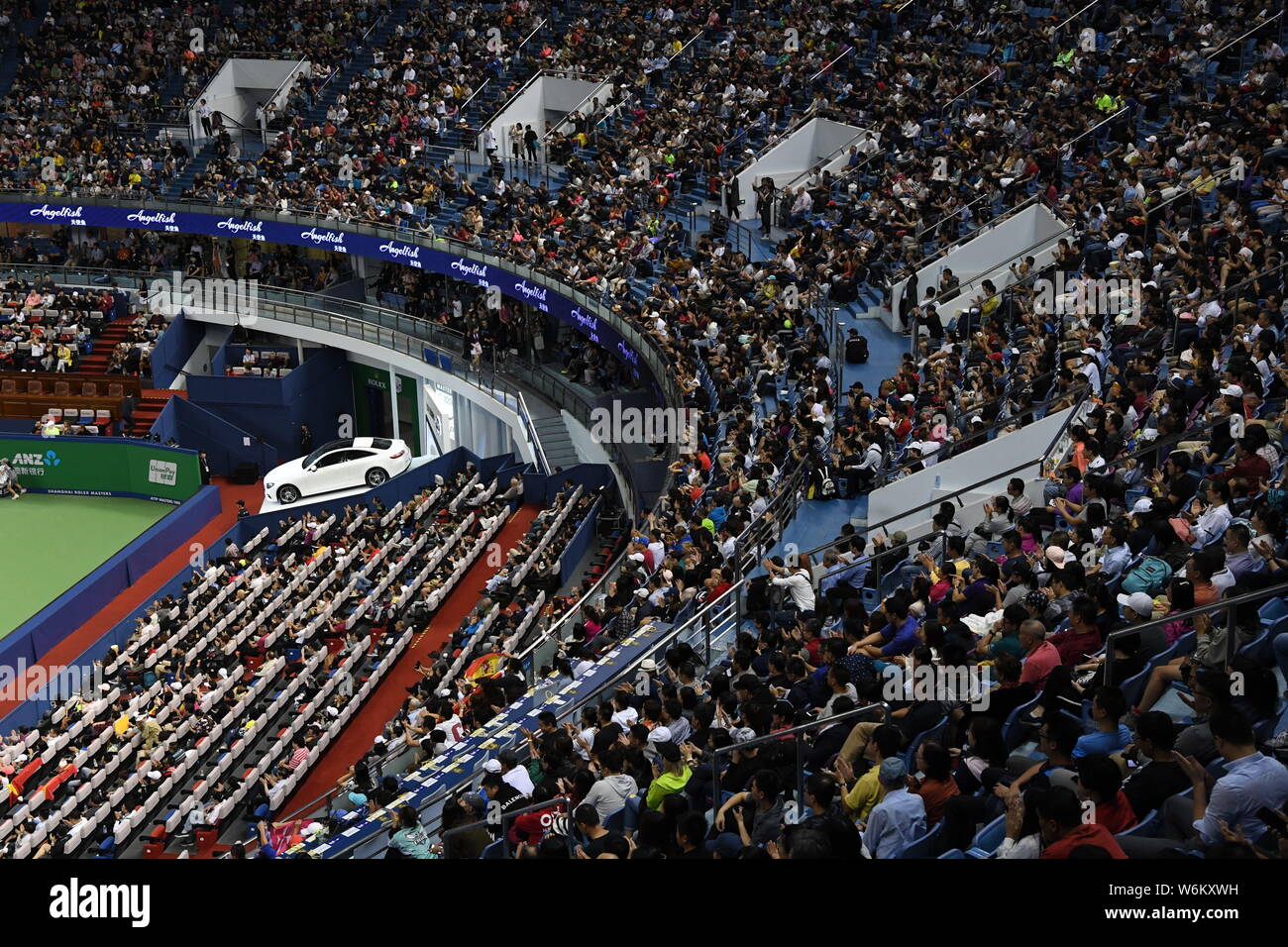 FILE--Spectators watch a men's singles match during the Shanghai Rolex  Masters tennis tournament at Qizhong Forest Sports City Tennis Center in  Shan Stock Photo - Alamy