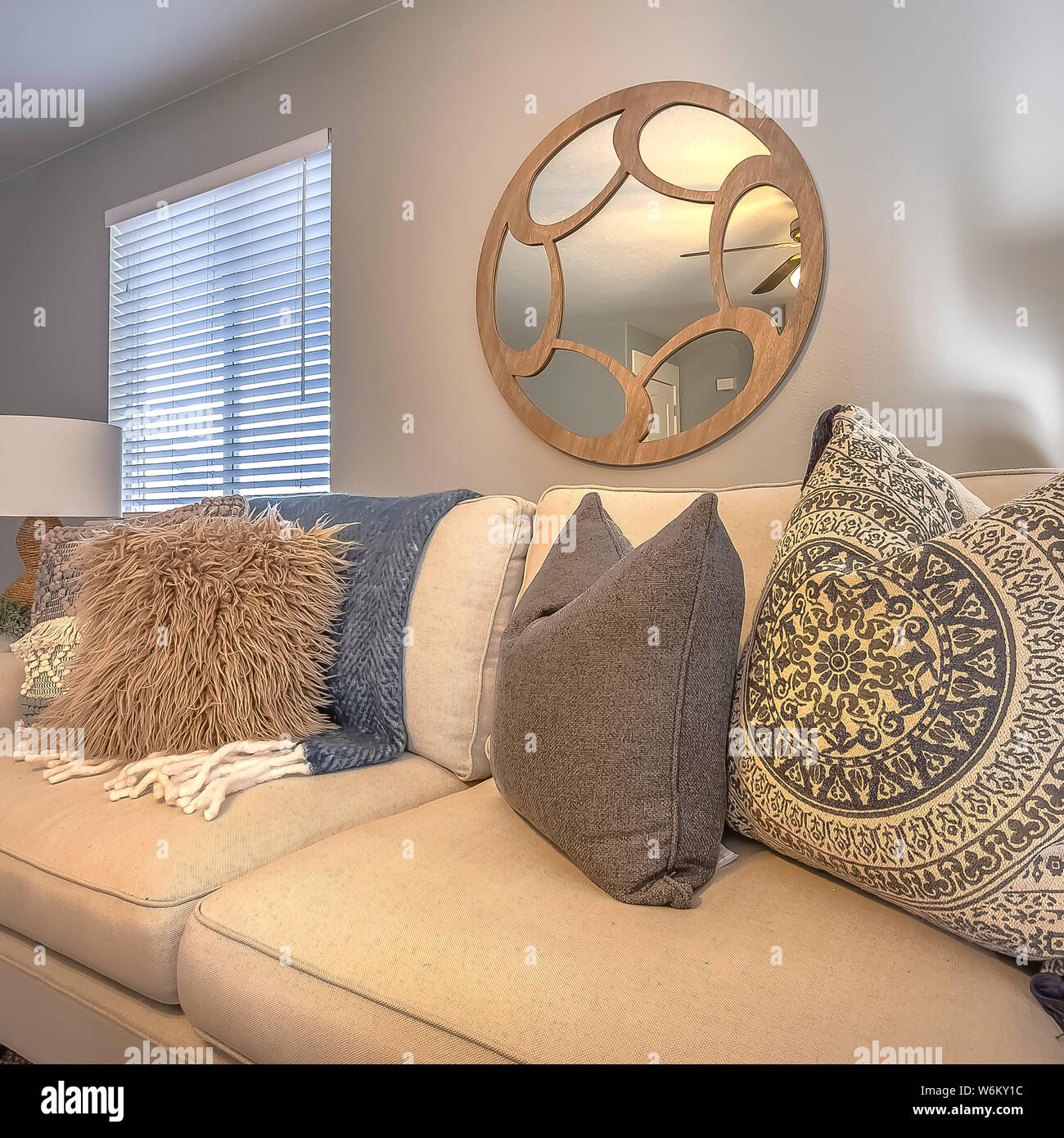 Square Frame Sofa With Fluffy Pillows Inside A Living Room With