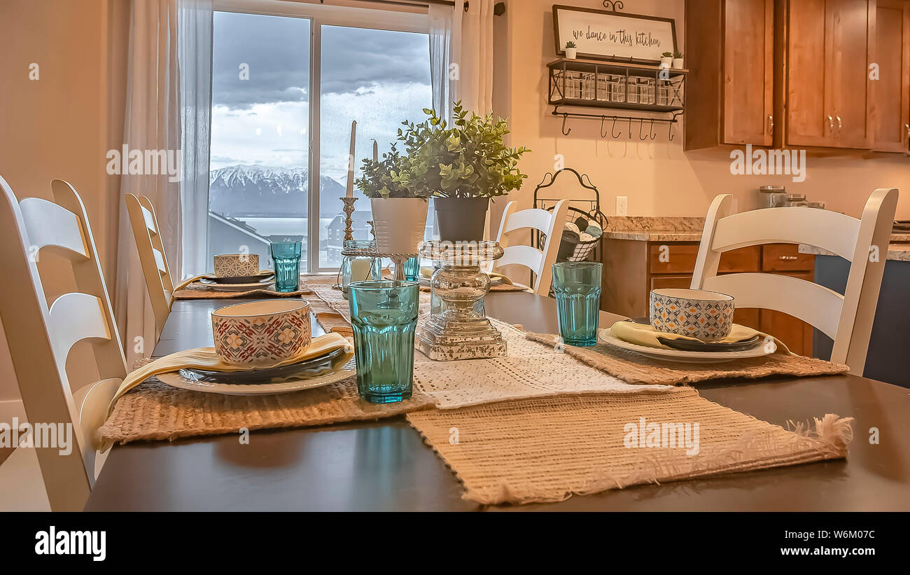 Panorama Dining Room With A View Through The Window Of Lake Snowy Mountain And Cloudy Sky Stock Photo Alamy
