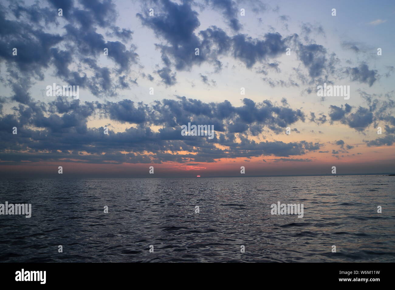 Purple sunset over sea on hi-res stock photography and images - Alamy