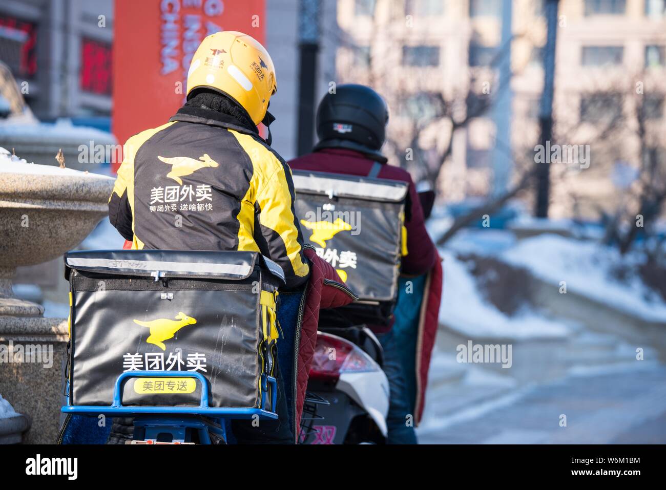 FILEDeliverymen of Chinese online food delivery company Meituan