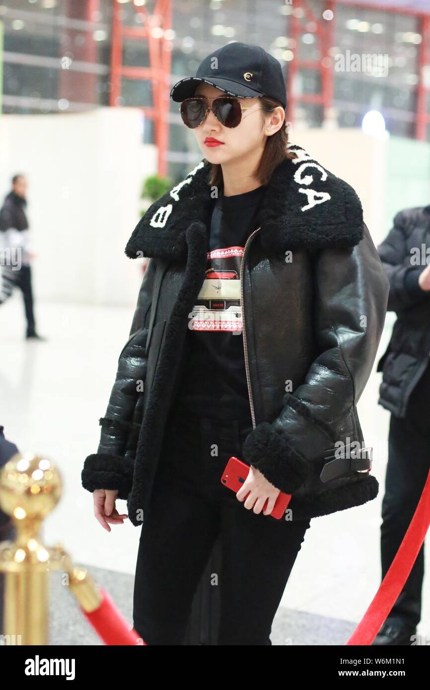 Chinese actress Jing Tian is seen wearing sunglasses in all-black outfit at  the Beijing Capital International Airport in Beijing, China, 16 January 20  Stock Photo - Alamy