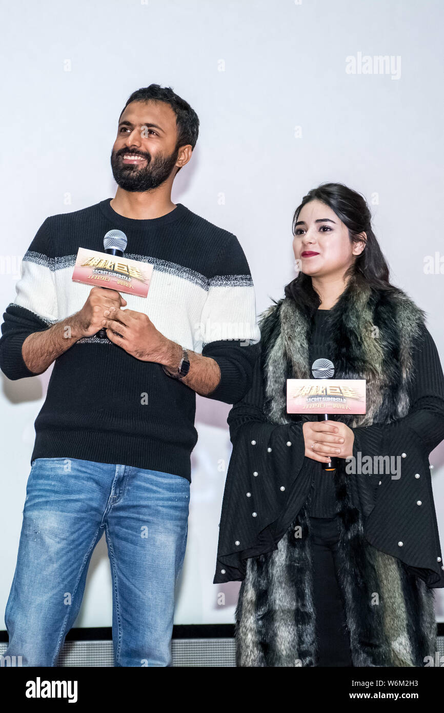 Indian director Advait Chandan and film child actress Zaira Wasim attend a premiere event for the new movie 'Secret Superstar' in Shanghai, China, 17 Stock Photo