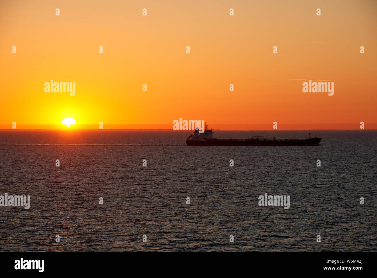 sunset above ocean while cruising through sea Stock Photo - Alamy