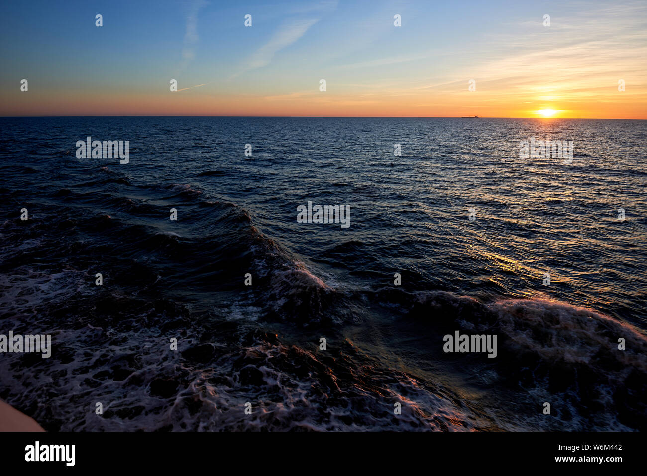 sunset above ocean while cruising through sea Stock Photo - Alamy