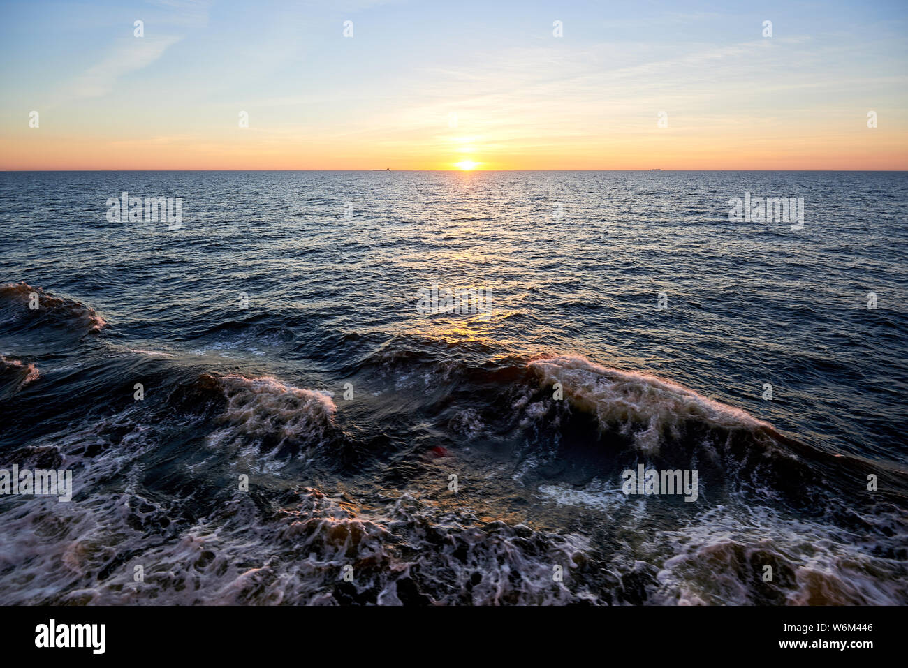 sunset above ocean while cruising through sea Stock Photo - Alamy
