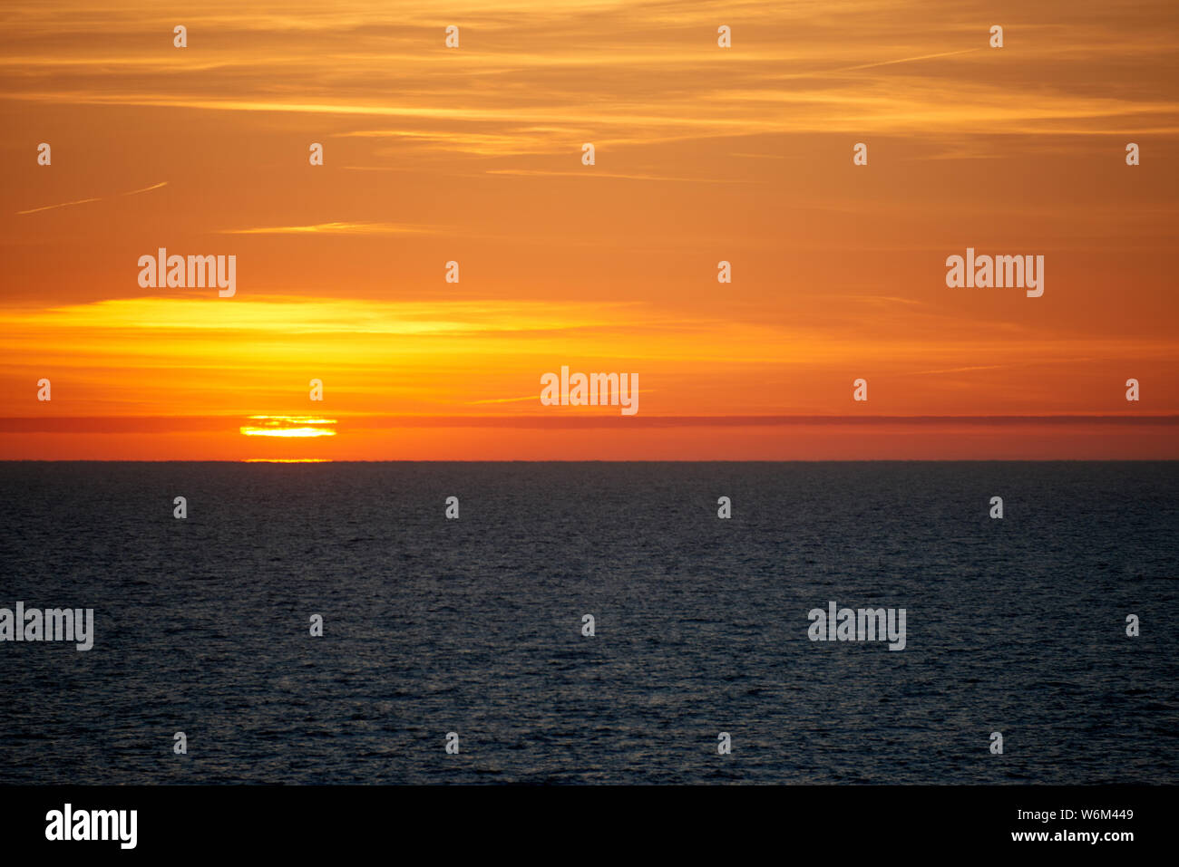 sunset above ocean while cruising through sea Stock Photo - Alamy