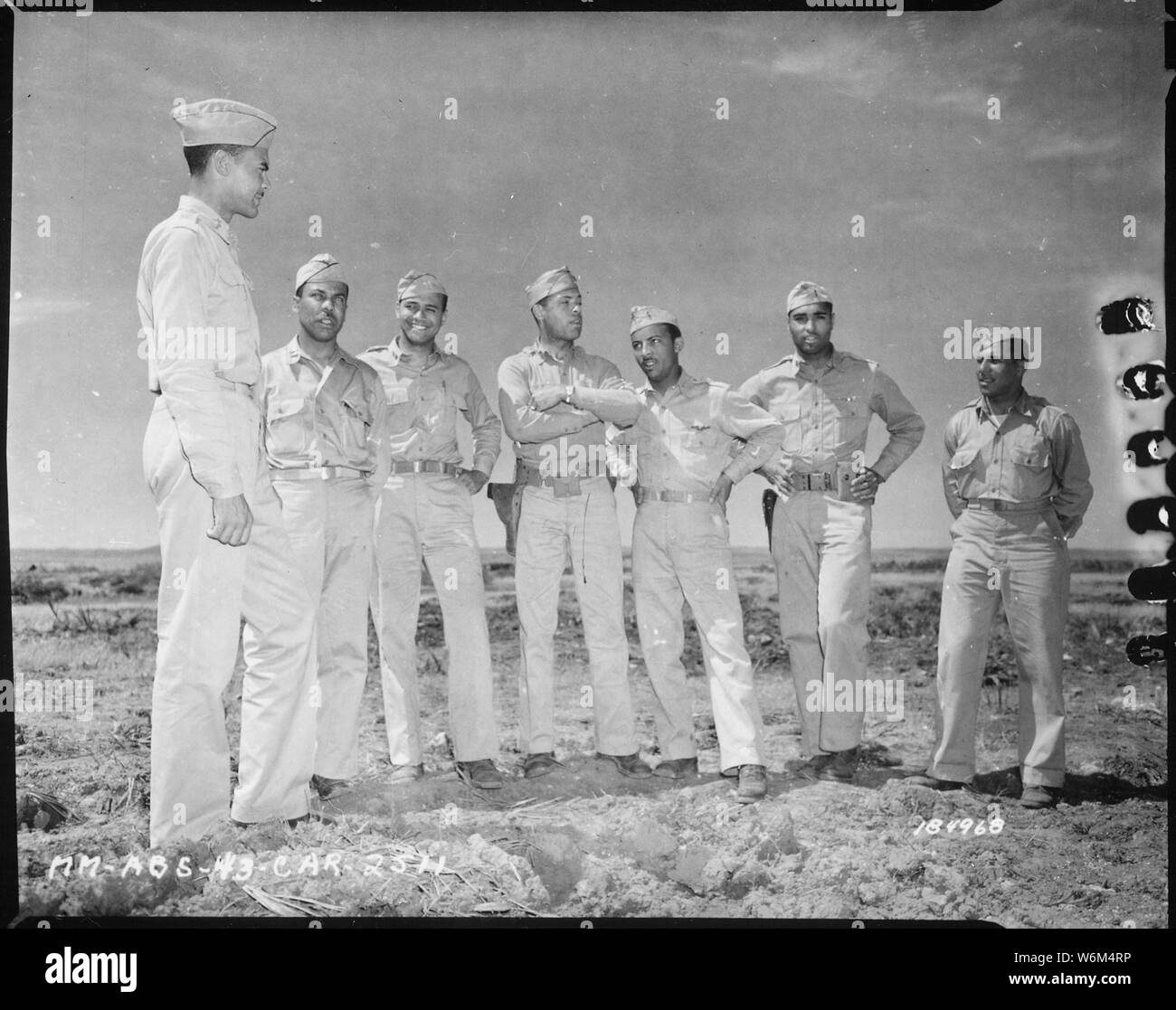 Staff officers of an...Air Corp Squadron near Fez, French Morocco. Left to right: Lt. Col. Benjamin O. Davis, C.O.; Capt. Hayden C. Johnson, Adjutant; Capt. E. Jones, Service Det.; Lt. Wm. R. Thompson, Armaments; Lt. Hervert E. Carter, Engineers; Lt. Erwin B. Lawrence, Operations; Lt. George R. Currie, Ordnance., 05/12/1943 Stock Photo