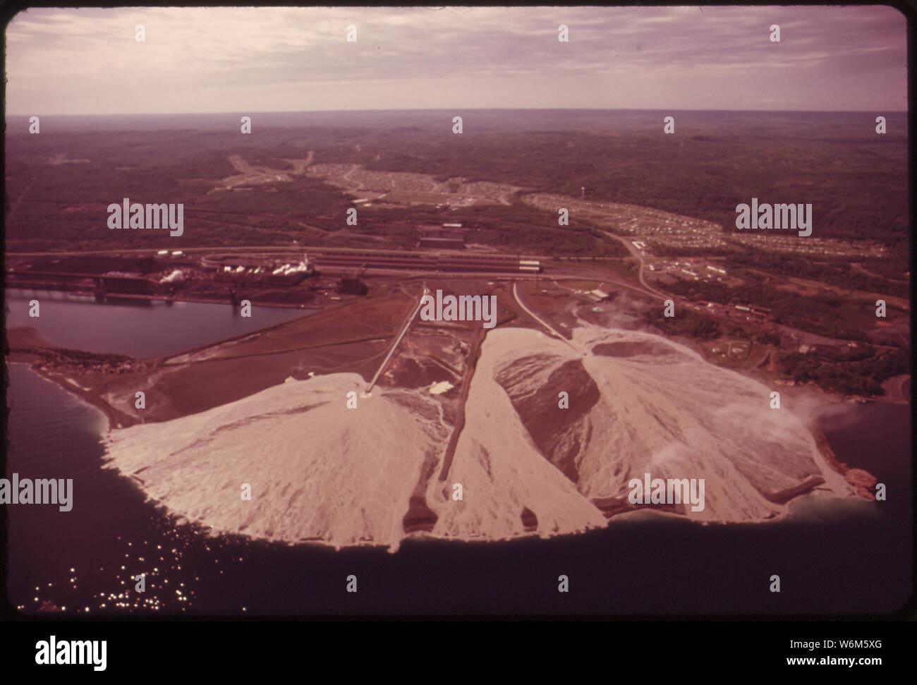 TACONITE TAILINGS FROM RESERVE MINING AT SILVER BAY ARE DISCHARGED INTO