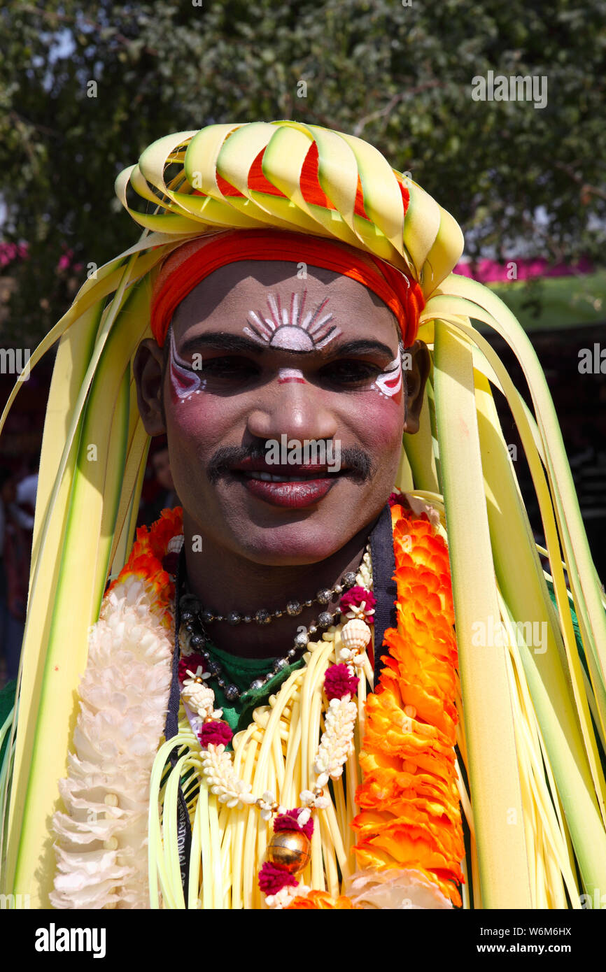 Tribal Indian man performing at Surajkund Crafts Mela, Surajkund, Faridabad, Haryana, India Stock Photo
