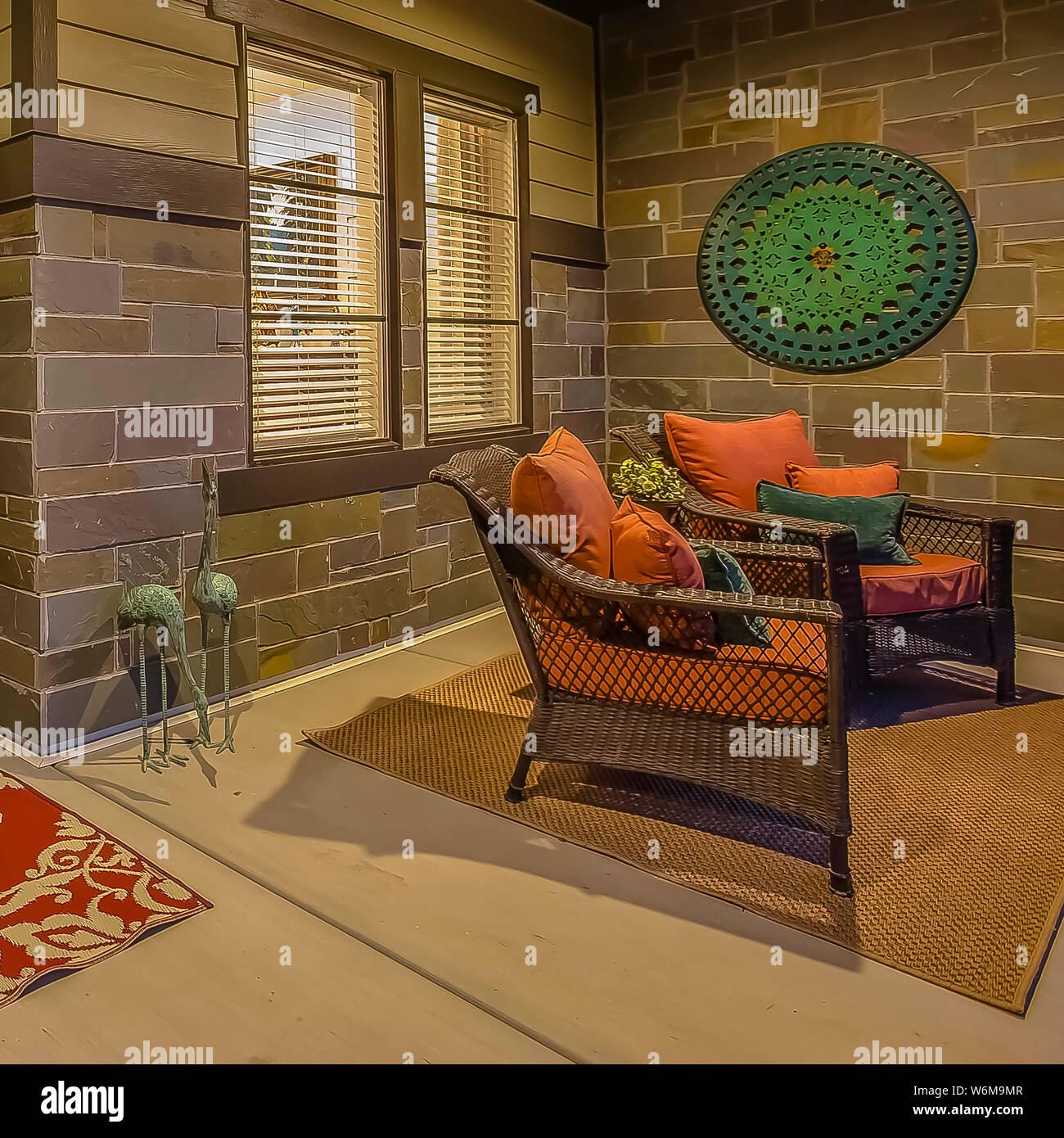 Square Aeating area carpets and wall decoration on the porch with stone