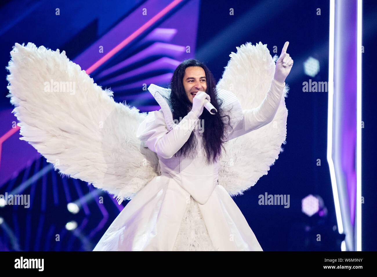 Cologne, Germany. 01st Aug, 2019. The comedian Bülent Ceylan stands on  stage as "Angel" at the ProSieben show "The Masked Singer". Credit: Marcel  Kusch/dpa/Alamy Live News Stock Photo - Alamy