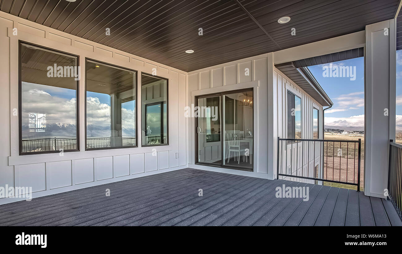 Panorama Spacious Balcony Of Home With White Wall And Round