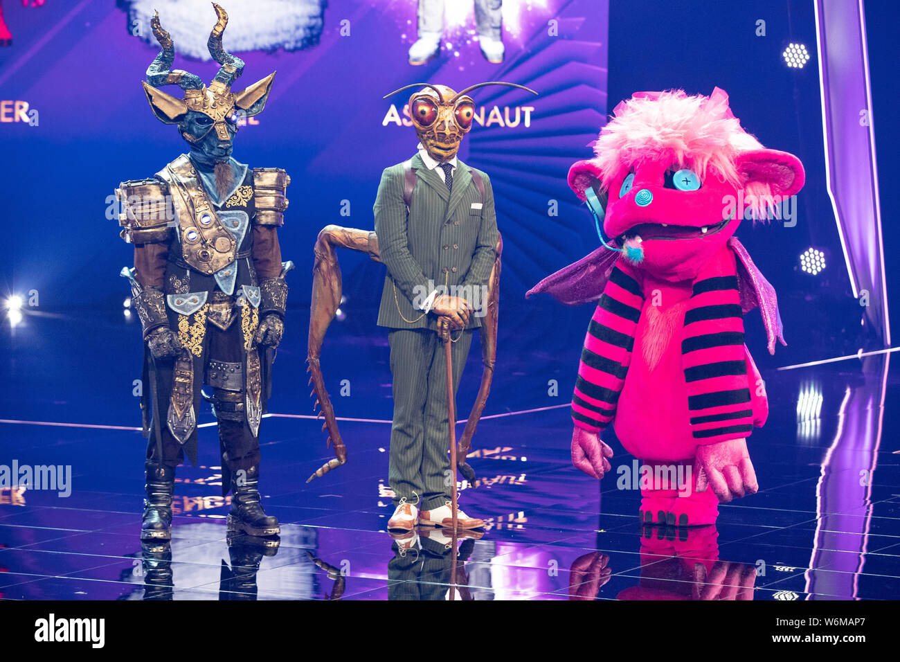 Cologne, Germany. 01st Aug, 2019. The character "Monsterchen" (r), the  character "Kudu" (l) and the character "Grashüpfer" are on stage at the  ProSieben show "The Masked Singer". Credit: Marcel Kusch/dpa/Alamy Live News