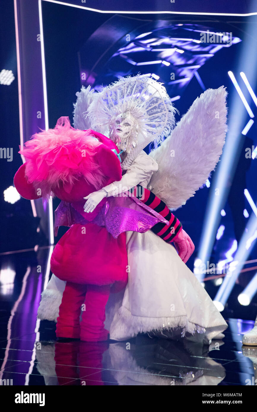 Cologne, Germany. 01st Aug, 2019. The character "Monsterchen" (l) and the  character "Engel" are on stage at the ProSieben show "The Masked Singer".  Credit: Marcel Kusch/dpa/Alamy Live News Stock Photo - Alamy