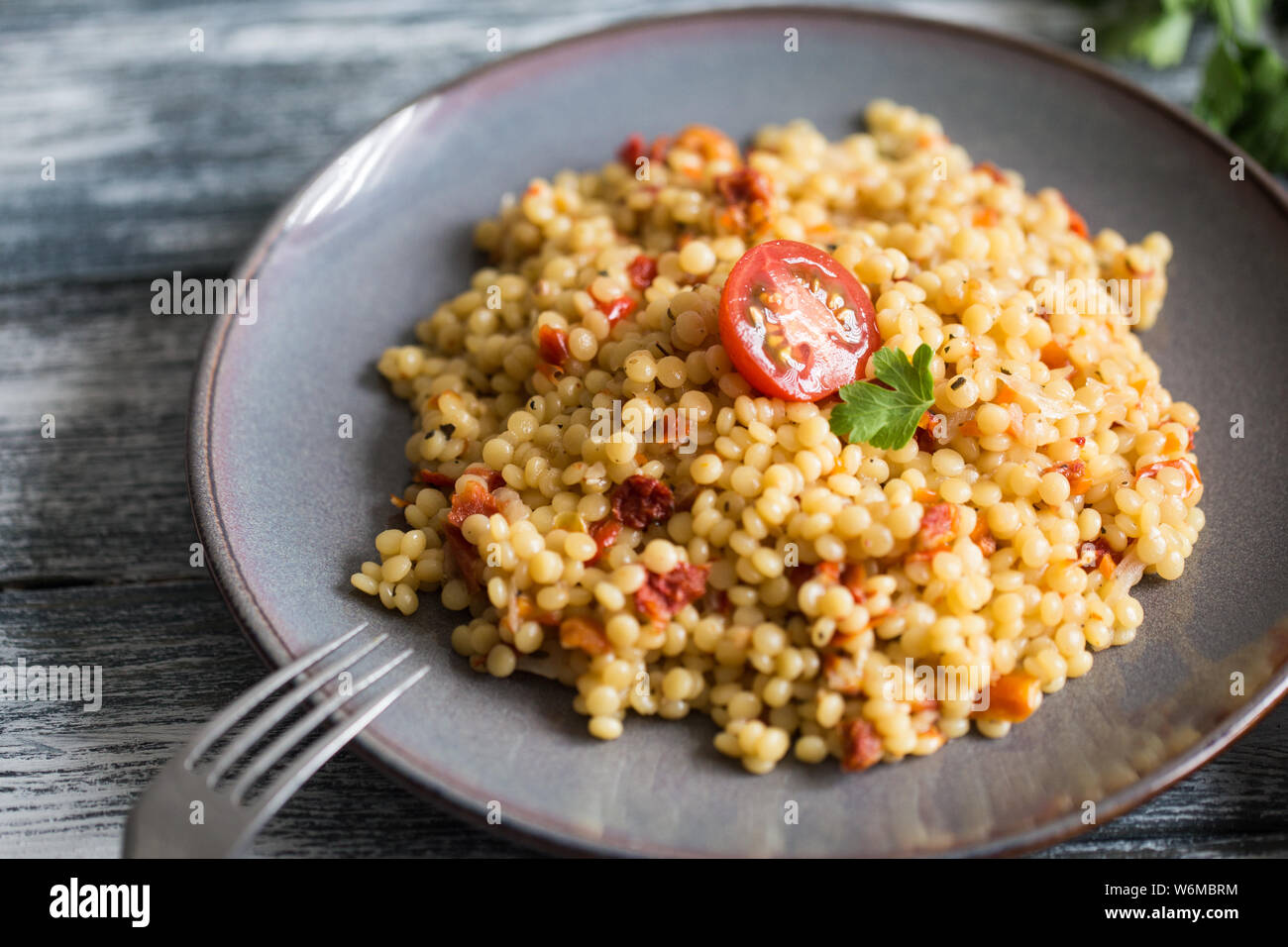 Ptitim Or Birdy Israeli Pasta Couscous With Tomatoes And Herbs Stock Photo Alamy