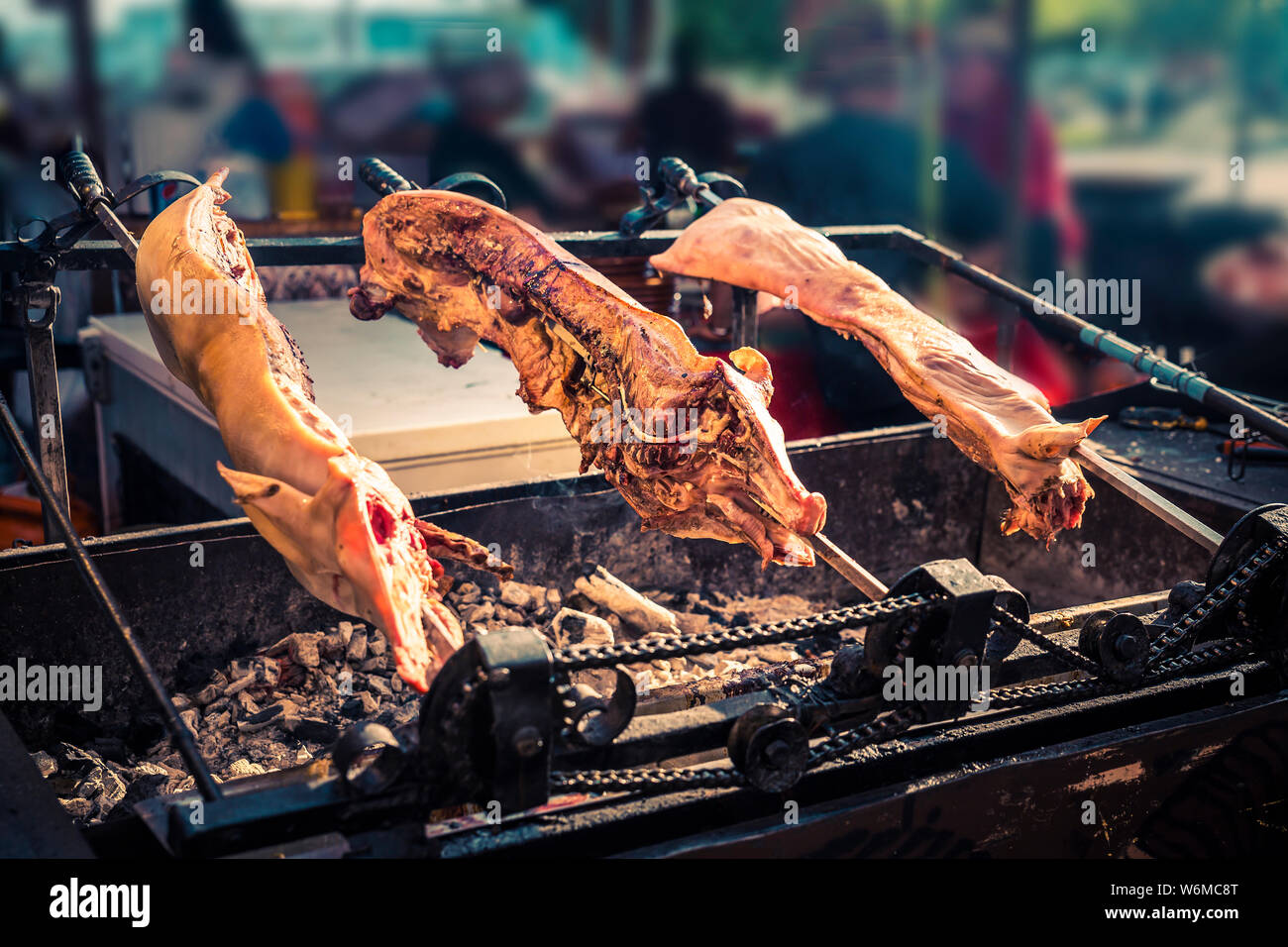 close up of piglet match in half on embers outdoor Stock Photo