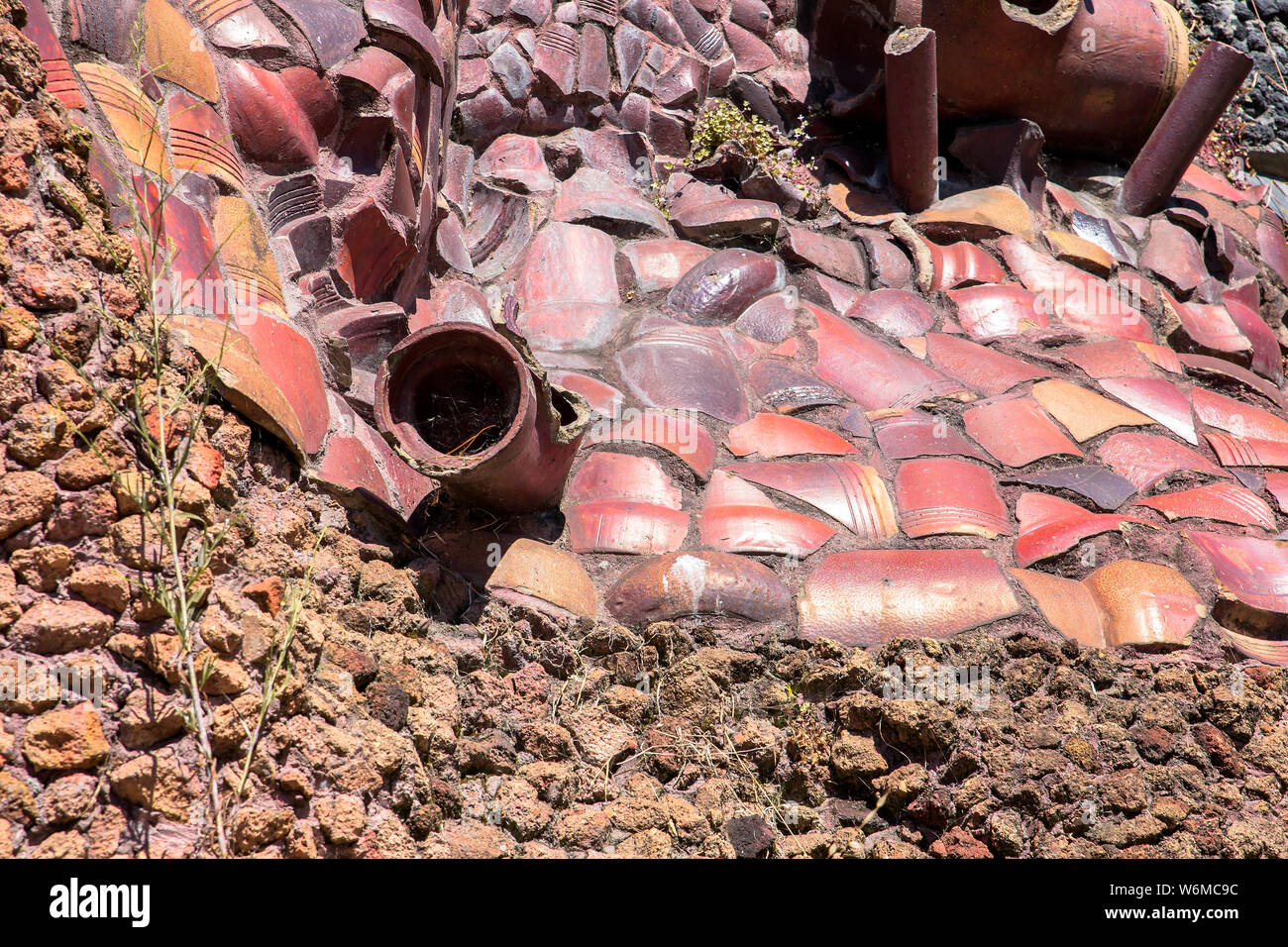 abstract background with differents stones and a pipe Stock Photo