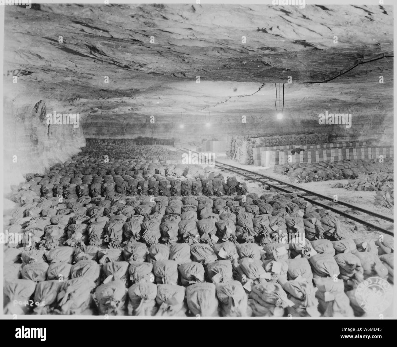 The 90th Division discovered this Reichsbank wealth, SS loot, and Berlin museum paintings that were removed from Berlin to a salt mine in Merkers, Germany., 04/15/1945 Stock Photo