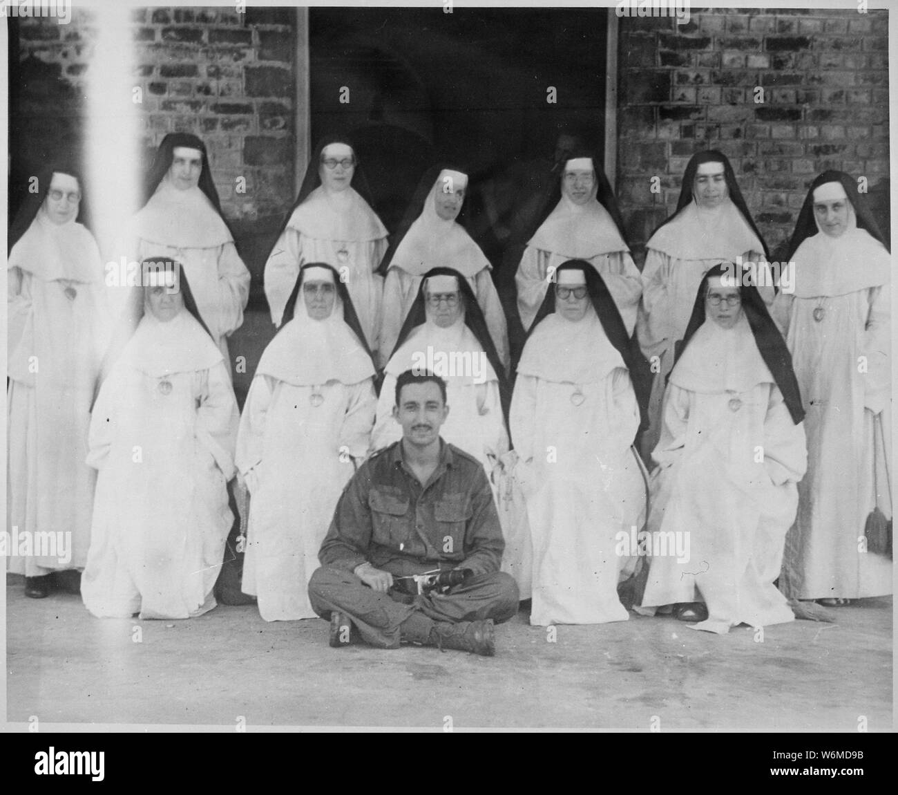 The Fighting Irish, Good Shepherd Convent. Thirteen Irish nuns who had been interned in the Rangoon City Jail by the Japanese, but were later released as neutrals. Burma, May 28, 1945.; General notes:  Use War and Conflict Number 1270 when ordering a reproduction or requesting information about this image. Stock Photo