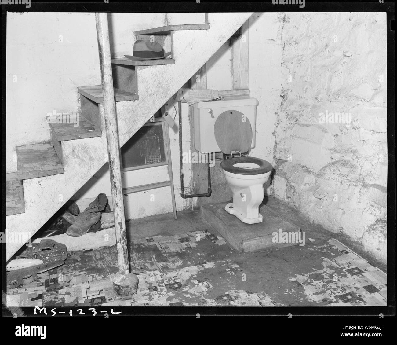 Toilet in basement of home of Kossi, who lives in company