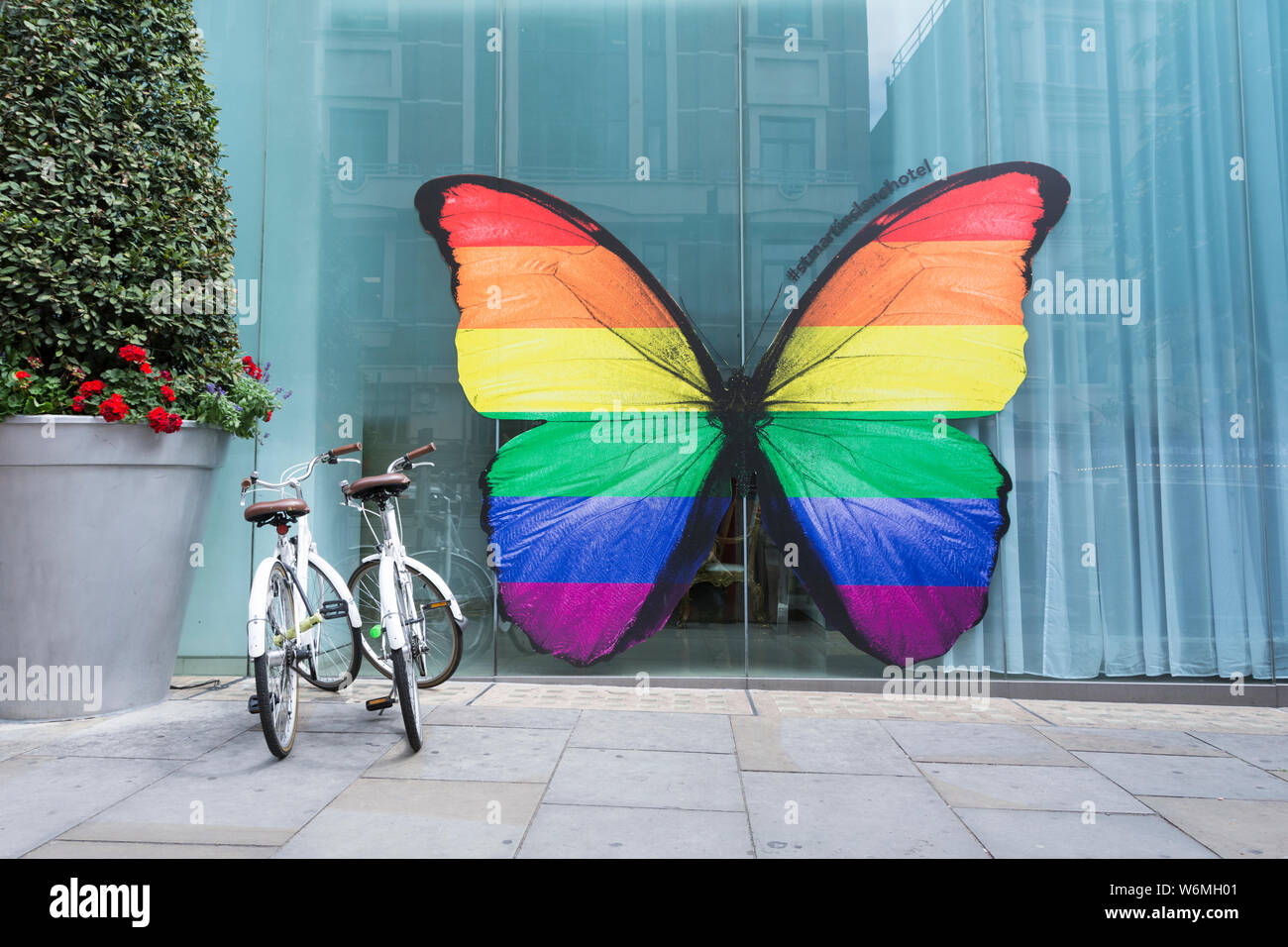 Pride Rainbow butterfly outside St Martins Lane Hotel, St Martins Lane, Charing Cross, London,  WC2, UK Stock Photo