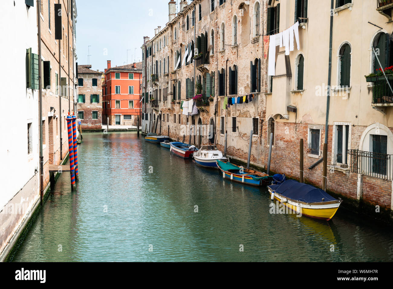 Canal Between Old Historic Houses In Venice Stock Photo - Alamy