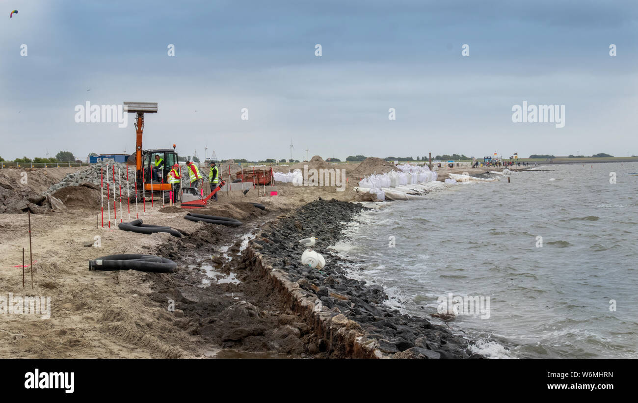 restoration of sand beach on coastline norderney, germany Stock Photo