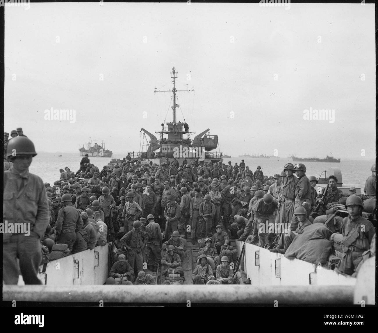 Troops of the 31st Infantry Regiment land at Inchon Harbor, Korea, aboard LST's.; General notes:  Use War and Conflict Number 1383 when ordering a reproduction or requesting information about this image. Stock Photo
