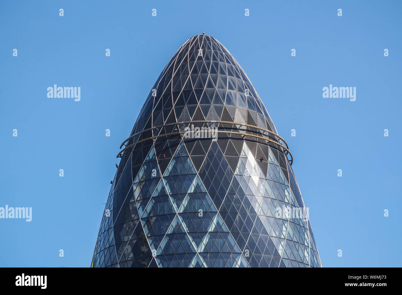London, UK - July 16, 2019 - 30 St Mary Axe (informally known as The Gherkin and previously as the Swiss Re Building) is a commercial skyscraper Stock Photo