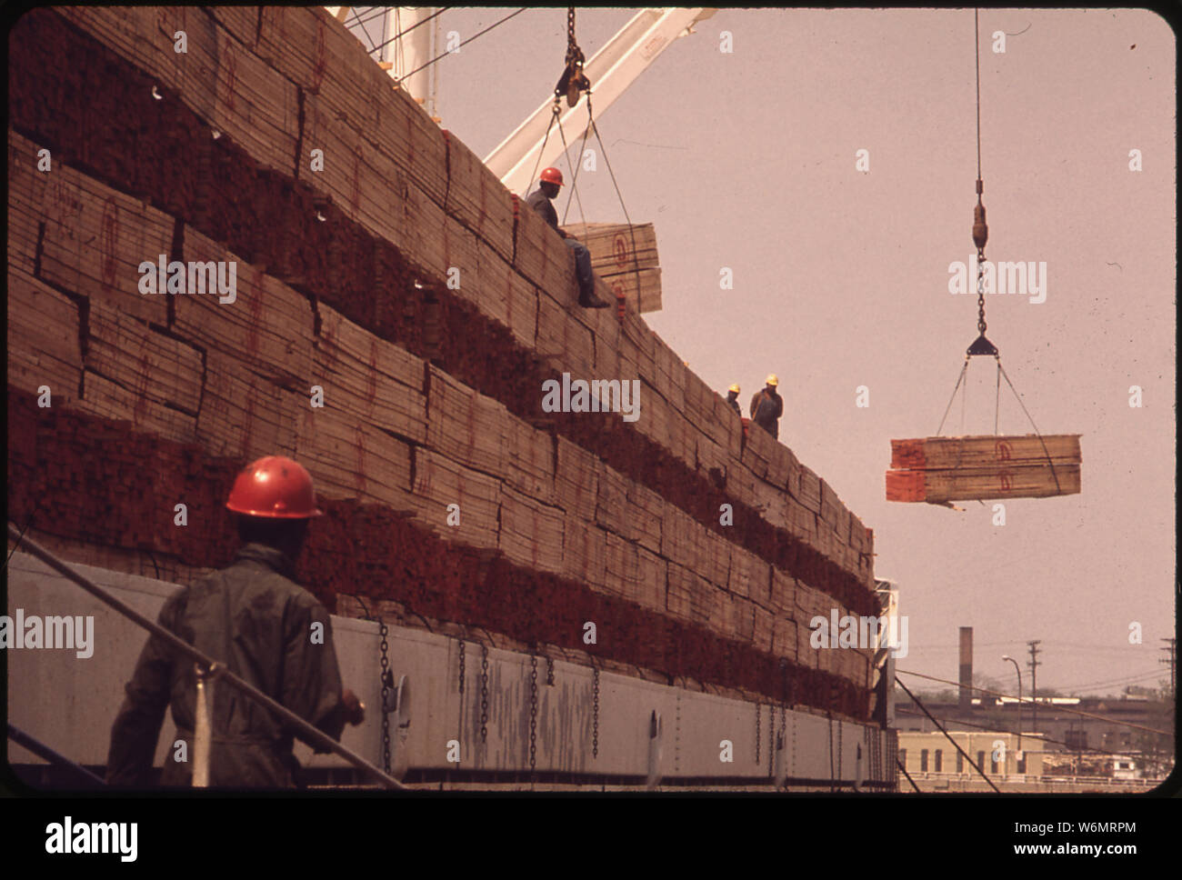 UNLOADING LUMBER FROM A SHIP DOCKED AT DUNDALK MARINE TERMINAL Stock