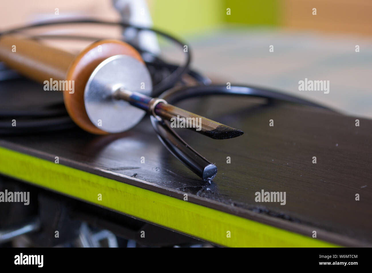 Ski or Snowboard base gouge repair with a ptex Iron and ptex string