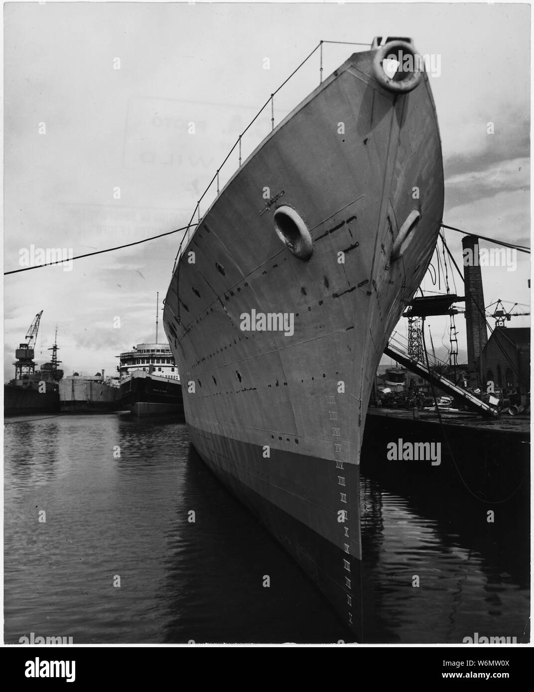 United Kingdom. Clydeban, Scotland. First British all-welded destroyer gets its finishing touches at the Clydebank yard of Fairfield Shipbuilding and Engineering Company, where 4,000 men work three shifts to keep the yard open all round the clock. The yard is also refitting old destroyers and building new oil tankers. Emphasis of naval program is on craft like destroyers, frigates, minesweepers which will meet the submarine menace Stock Photo