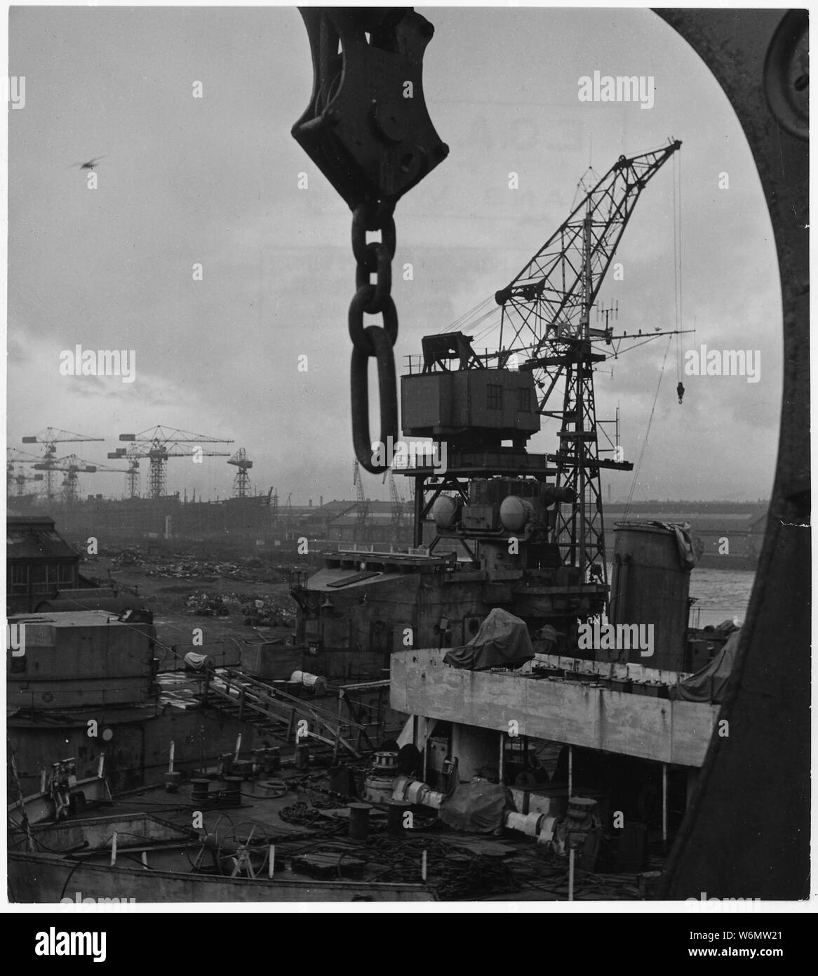 United Kingdom. Clydeban, Scotland. First British all-welded destroyer get its finishing touches at the Clydebank yard of Fairfield Shipbuilding and Engineering Company, where 4,000 men work three shifts to keep the yard open all around the clock. The yard is also refitting old destroyers and building new oil tankers. Emphasis of naval program is on craft like destroyers, frigates, minesweepers which will meet the submarine menace Stock Photo